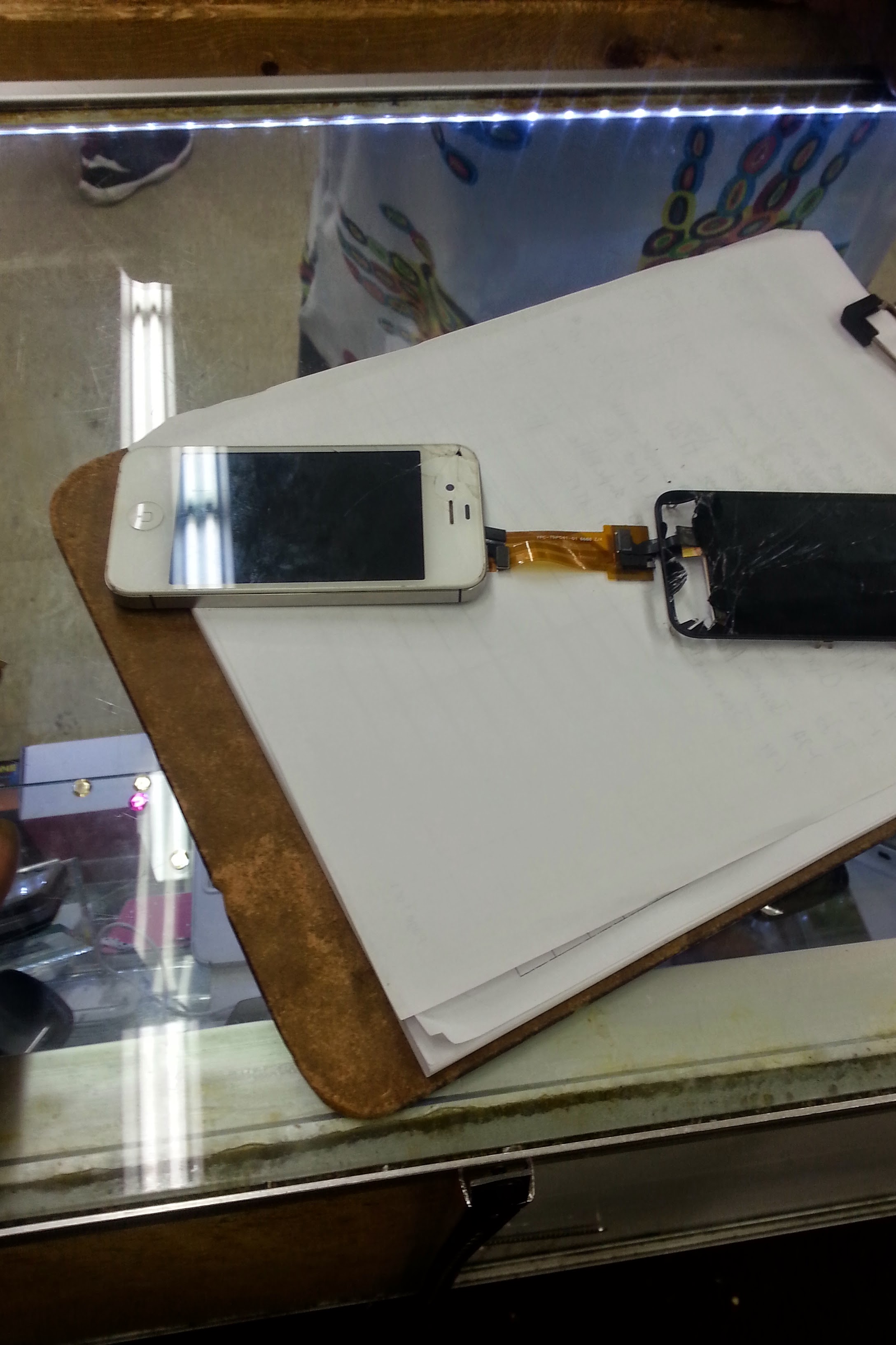 Phone repair storefront at 285 Flea Mart Decatur GA - Customer service and phone repair consultation